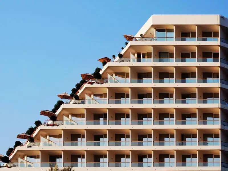 The hotel exterior framed by evening light