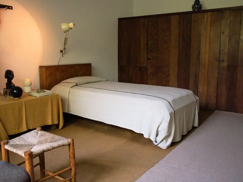 The Brass Suite with warm wood panelling and brass fixtures
